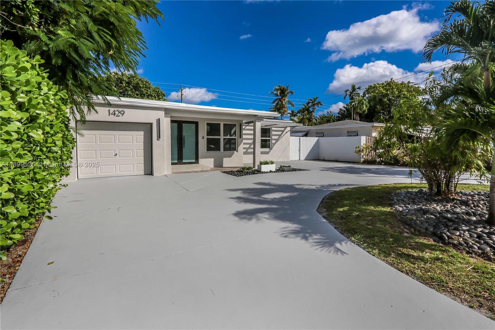 Spacious and beautifully designed, this 4-bed, 4-bath home plus den spans over 2,700 sq ft. An open layout w/ high vaulted ceilings, sleek 31x31 porcelain tile floors, recessed lighting through out & an abundance of natural light. A chef’s kitchen features quartz counters with a waterfall edge, stainless double sink, newer appliances, & a large pantry. Two primary suites include elegant baths with rain showers and glass enclosures, while a Jack-and-Jill bath connects addt'l bedrooms. The fifth room (den) serves perfectly as an office with its own closet and windows. Key features: Impact windows/ doors, a new roof, newer A/C units, & hardwired security system. Outside, you'll find beautiful curb appeal, a covered front porch, large circular driveway, a fenced backyard with room for a pool.