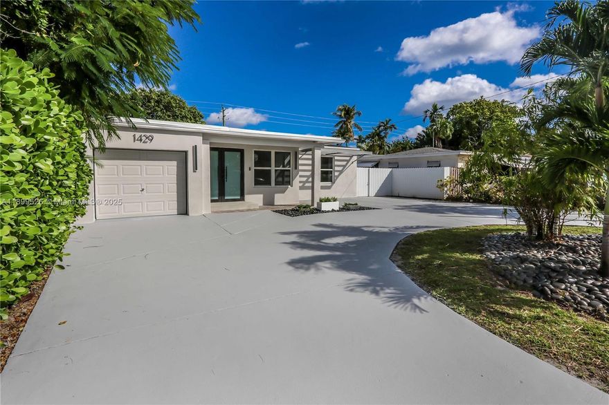Spacious and beautifully designed, this 4-bed, 4-bath home plus den spans over 2,700 sq ft. An open layout w/ high vaulted ceilings, sleek 31x31 porcelain tile floors, recessed lighting through out & an abundance of natural light. A chef’s kitchen features quartz counters with a waterfall edge, stainless double sink, newer appliances, & a large pantry. Two primary suites include elegant baths with rain showers and glass enclosures, while a Jack-and-Jill bath connects addt'l bedrooms. The fifth room (den) serves perfectly as an office with its own closet and windows. Key features: Impact windows/ doors, a new roof, newer A/C units, & hardwired security system. Outside, you'll find beautiful curb appeal, a covered front porch, large circular driveway, a fenced backyard with room for a pool.
