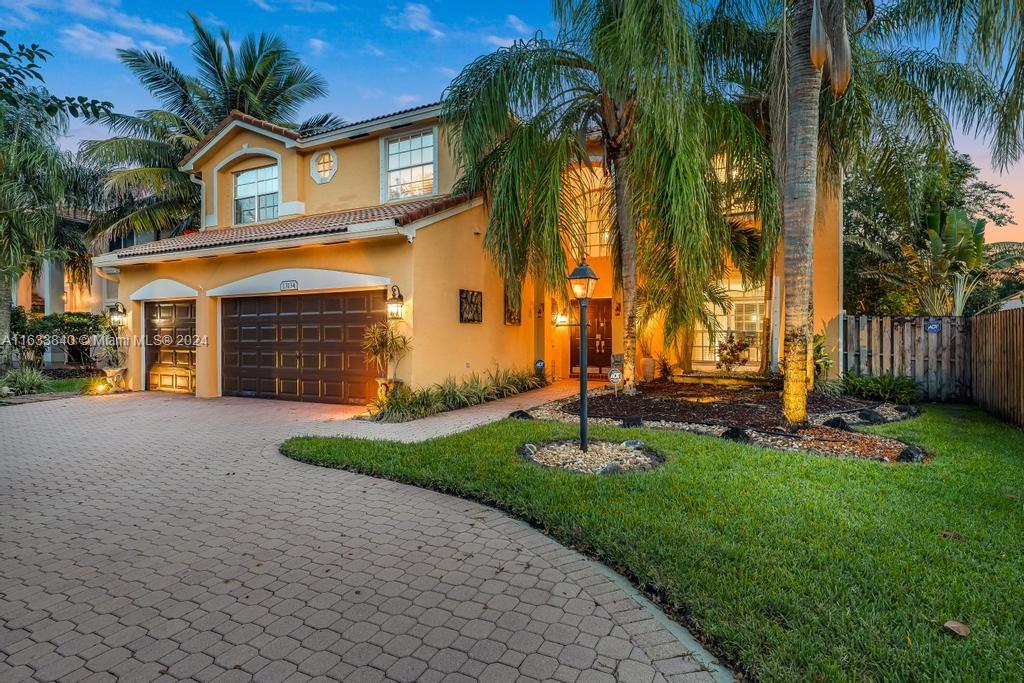 Immaculately kept lakefront property located in sought after gated community of Pembroke Falls. This stunning two-story residence boasts 5 bedrooms, 4 bathrooms, and a 3-car garage. One of the bedrooms with a full bath is on the first floor. The oversize master suite features an inviting sitting area. The kitchen has wood cabinets, granite countertops, and SS appliances. The backyard is an oasis of tranquility with a covered patio, ideal for enjoying relaxing lake views and ample space for a pool. Pembroke Falls offers first-class amenities, including a grand clubhouse, heated pool, gym, and courts for tennis, pickleball, and basketball. Maintenance included services: Cable, 24-hour security, alarm system, and fiber optic internet.
This extraordinary home is a rare find, come see it!