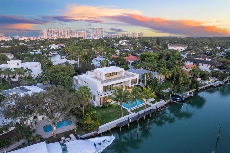 Discover unparalleled luxury at 960 Mariner Dr, Key Biscayne. This new architectural gem offers over 9,500 SF of living space on a 15,381 SF lot with 106 feet of water frontage. Featuring 6 bedrooms, 8 baths, and 2 half baths, the open-concept design boasts floor-to-ceiling glass, providing stunning views. A 4-person elevator connects all levels, including a third-floor terrace with 360-degree views of the water and Miami skyline. The chef’s kitchen, resort-style pool, summer kitchen, and private dock with direct Bay access make it perfect for entertaining. Boating enthusiasts will appreciate the ski boat crane. This estate combines modern elegance, privacy, and top-tier amenities in one of Miami’s most exclusive areas.