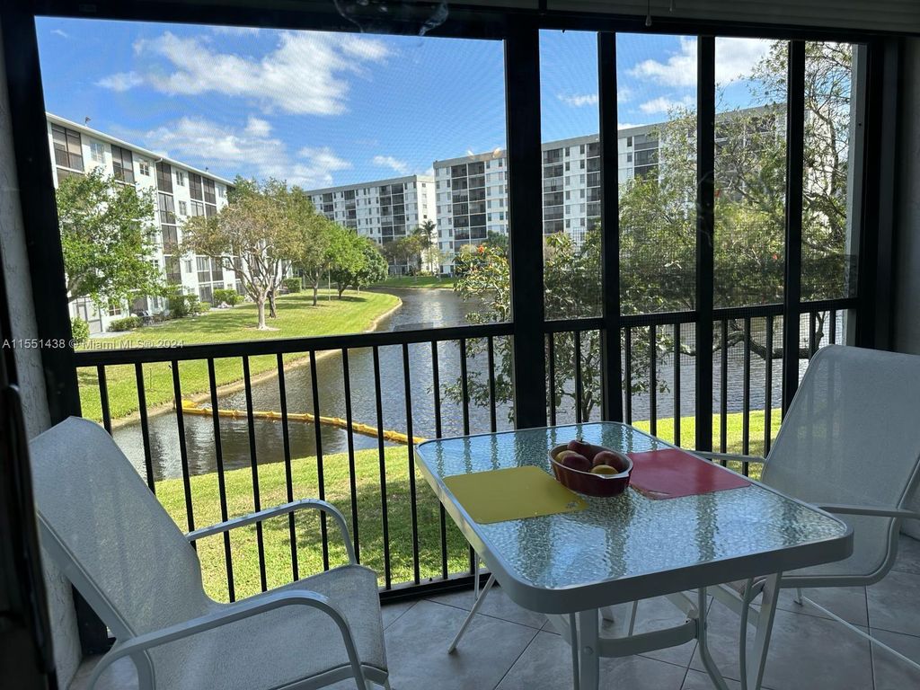 Photo of 2228 N Cypress Bend Dr #203, Pompano Beach, FL 33069 (MLS # A11551438)