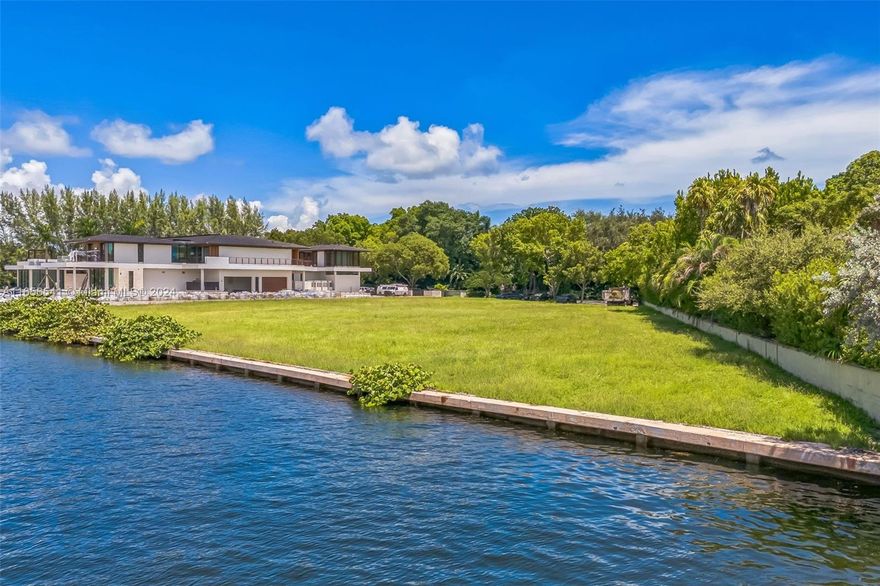 Unique 1.38-acre waterfront lot in the exclusive Gables Estates community. This rare opportunity offers an expansive vacant lot ready for development, featuring 313 linear feet of waterfront just steps from the open bay, with no fixed bridges, providing seamless access for boating enthusiasts. Nestled in the prestigious Gables Estates community, renowned for its privacy, security, and luxury, this is the only and one of the largest vacant lots available for sale in the neighborhood.