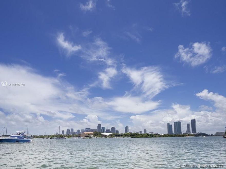 Reduced over $1 Million! This rarely available 4B/3.5BA on a 13,382 SF pie-shaped lot, has 104' of waterfront as per survey of SW wide water/downtown views w/dock! Towering palms lead to this impressive remodeled home w/deco details, gas appls, wood & terrazzo floors, 2car garage, electric gates, impact windows, new roof, private courtyard & elevator to rooftop terrace. Equal distance to DT & Mia. Beach w/Mia Beach zip code & school district with Miami zoning. Live in or rebuild a new modern grand estate.