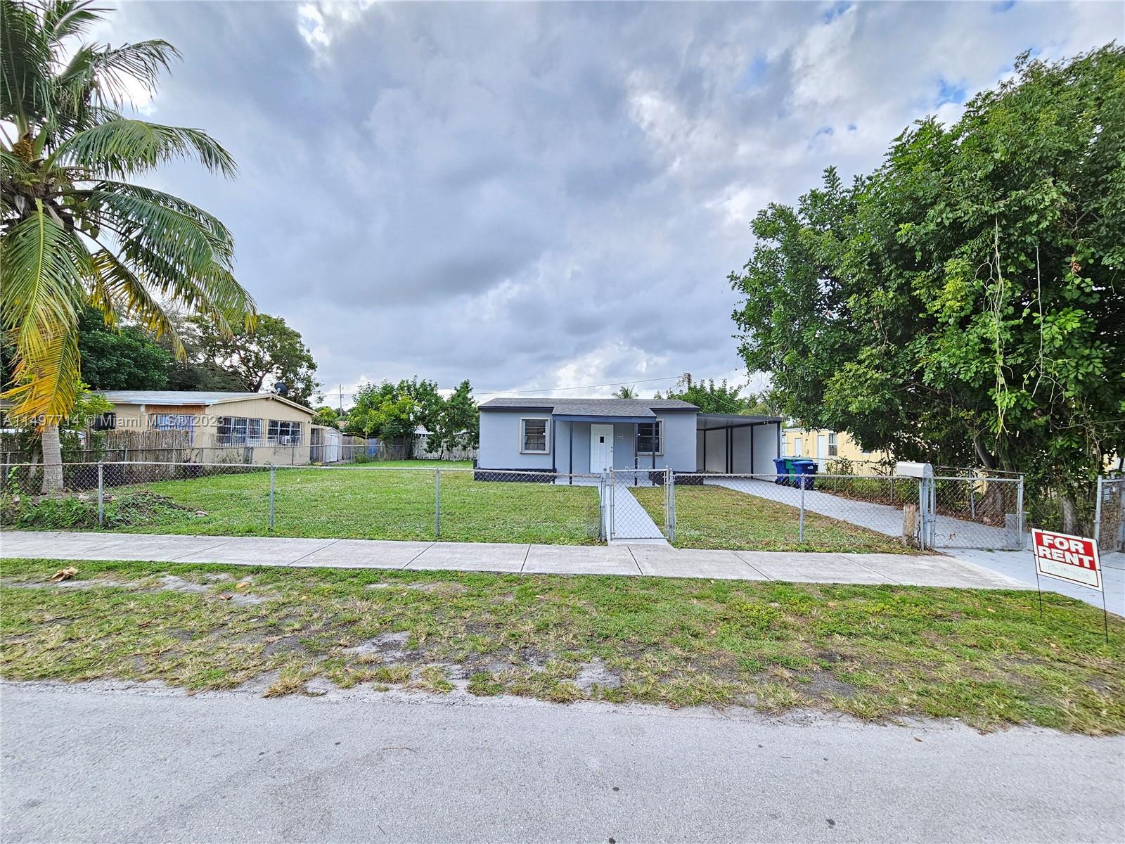 PRICE IMPROED!! Enjoy this Single Family home with 2/1 on a spacious lot and large carport. New roof, Vinyl water proof floors with remodeled kitchen with granite counter tops and modern bathroom, Central AC, laundry hook ups and accordion hurricane shutters. Central location close to highway and public transportation.