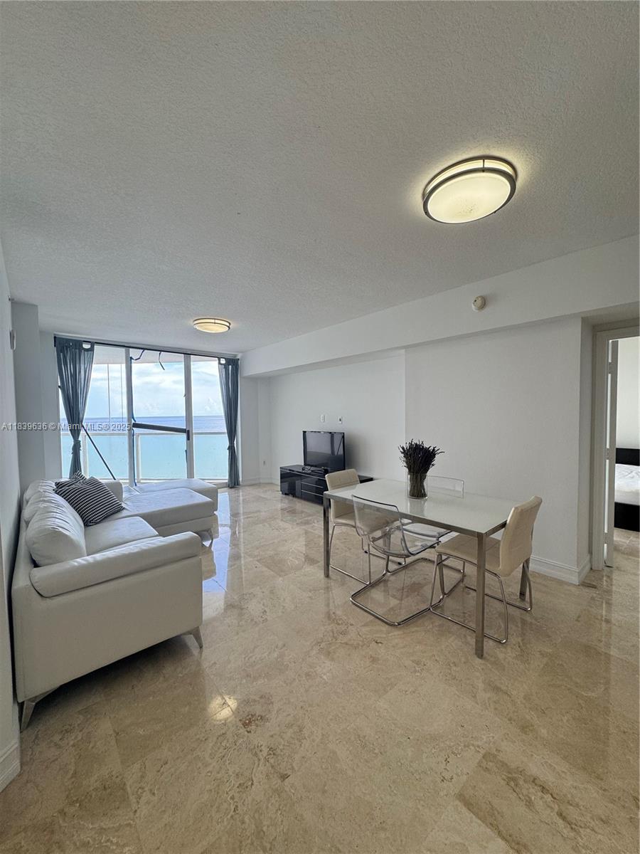 Beautiful beach condo 2 bedrooms 2.5 with SE exposure!!Spanning over 1600 SF, this magnificent waterfront residence partially furnished, with endless ocean views, wall-to-wall windows, tile throughout, is available for rent!! The open floor plan encompasses three spacious private spaces with plenty of living room, all with its own balconies, and a stylish modern kitchen! Enjoy all full building amenities fully beach service, valet parking service, gym, heated pool, sport lounge, children's room and more!