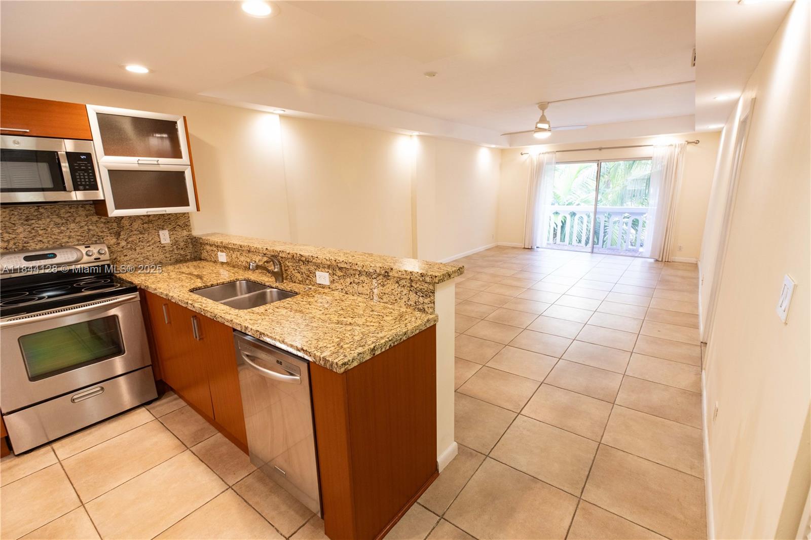 Live in a prime location in a relaxing, bright and airy condo. Spacious one bedroom with one and one half bath. Open floor plan with an updated kitchen, granite countertops and SS appliances. Unit has tile floors throughout, two updated baths, primary bathroom with a walk-in shower, bedroom has two spacious closets. Enjoy the open balcony and (1) one assigned parking space. The building has several laundry facilities, beautiful gardens, BBQ area and pool overlooking the canal, boats and beautiful homes. Steps away from the water and parks. Close to restaurants and entertainment in the Gables and Coconut Grove. Easy to show.