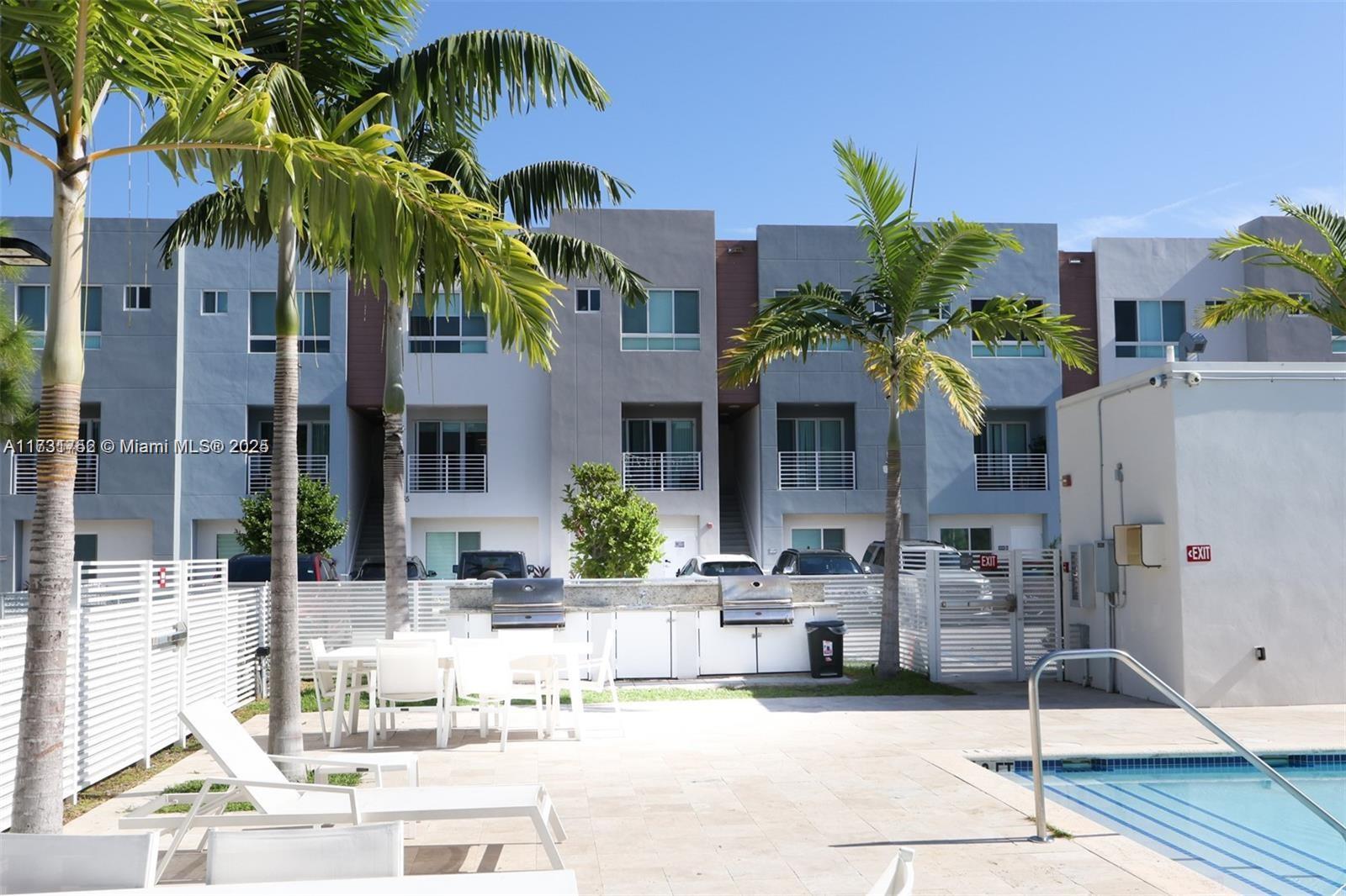 Aventura Village, completed in 2020, features spacious split-level, contemporary townhomes centrally located near Aventura, on W. Dixie Highway. This beautiful unit features an open kitchen floor plan with center island, stainless steel appliances, soft-close cabinets and split living and dining areas for extra comfort. Bedrooms are located on the second level, along with a comfortable den/home-office space, and convenient full-size washer and dryer units upstairs. This residential complex is fenced with gated entry for extra security, while the community pool adds just the right touch for weekends at home. This lovely unit is perfect for an end-user or an investor, as it is currently leased. No assessments. Low monthly maintenance.