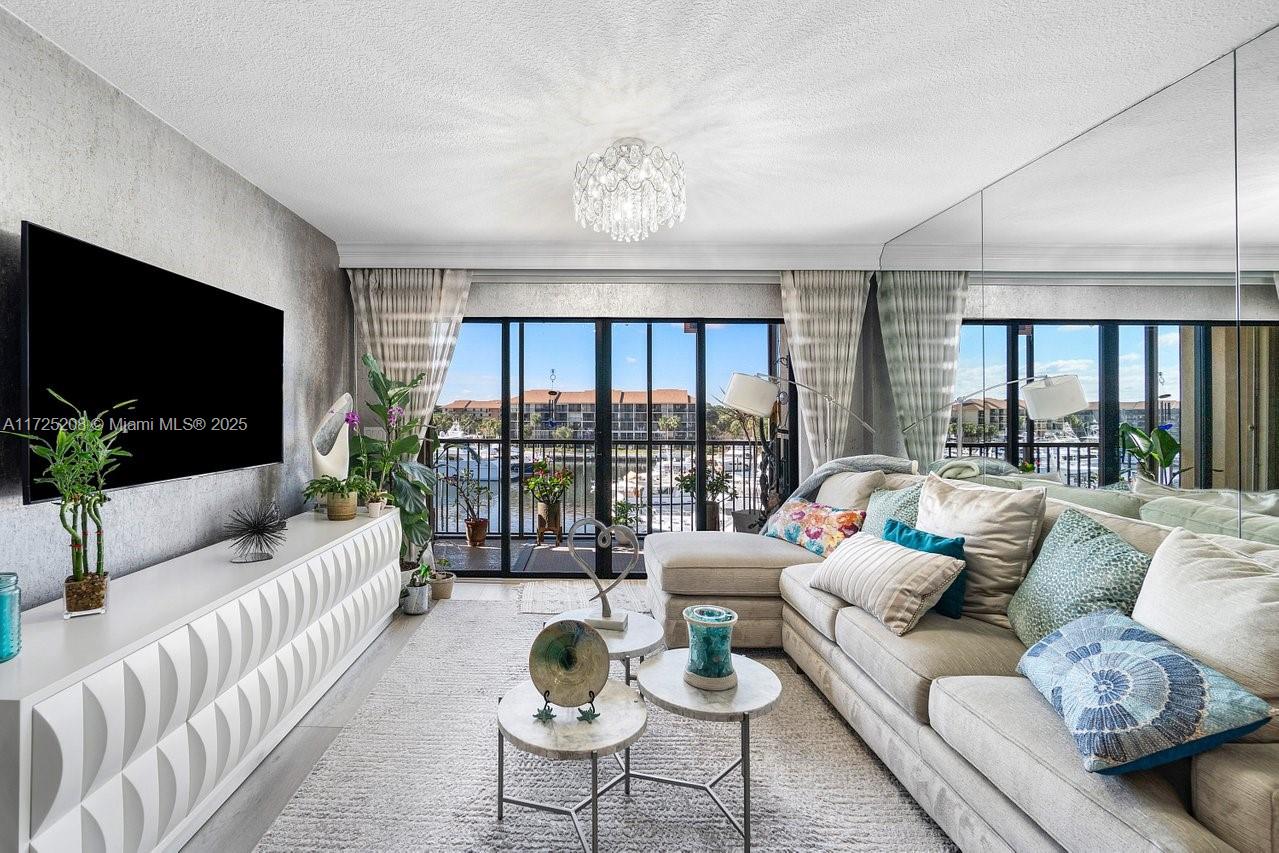 Discover coastal elegance at Marina at the Bluffs in Jupiter, FL! This stunning 2-bedroom, 2-bathroom condo offers breathtaking marina views, capturing the essence of waterfront living. A spacious bonus room and dedicated laundry room enhance the functional layout, providing versatility and convenience. The light-filled interiors feature an open floor plan, perfect for relaxing or entertaining. Step onto the private balcony to enjoy picturesque sunsets and serene water views. Nestled in a vibrant community with resort-style amenities, including pools, tennis courts, and proximity to pristine beaches, dining, and shopping. Don’t miss this rare opportunity to own your slice of paradise!