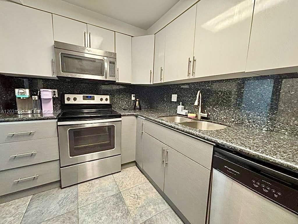 Photo of 301 Golden Isles Dr #406, Hallandale Beach, FL 33009 (MLS # A12031324)