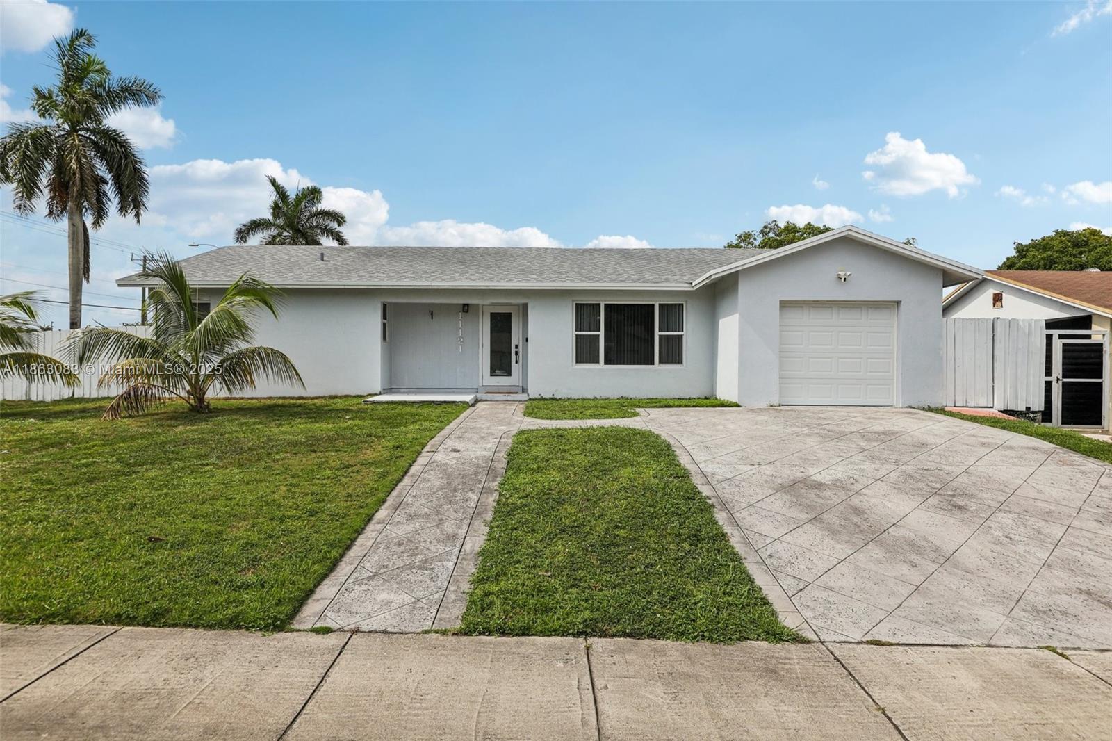 Welcome to this lovely single-family home at 11121 SW 162nd Terrace, Miami, FL 33157! Featuring a spacious driveway and big windows throughout, this home is filled with natural light. The living area offers plenty of room to gather, while the kitchen boasts wood cabinetry and ample storage. Bedrooms are comfortable and bright with large windows, and bathrooms are well-appointed for everyday convenience. A dedicated laundry area with washer and dryer hookups adds practicality. Step outside to the spacious backyard, perfect for entertaining, gardening, or relaxing. Ideally located near schools, shopping, dining, and major highways, this residence is move-in ready and a wonderful opportunity.
Assumable loan available at 3.25% interest rate for those who qualify!