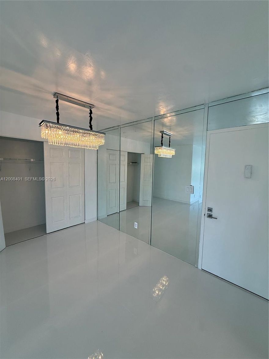 Fully remodeled. Low HOA. Everything is brand new! Brand new floor, bathrooms, kitchen, appliances, granite, fixtures. Open airy inviting condo full of sunlight. Personal entry from garden. Secure building with 2 car parking, tropical swimming pool, gym, library, sauna, recreation room. Access controlled parking garage. Tennis & pickleball courts. In the middle of multimillion dollar houses and condo. This is a steal! Great for personal use or investment. Enjoy sunny Florida with your ownership! 5 min walk to intercostal & water taxi.  10 min walk to beach. Steps from all restaurants, shopping, dining, groceries, banks. Luxury apartment.