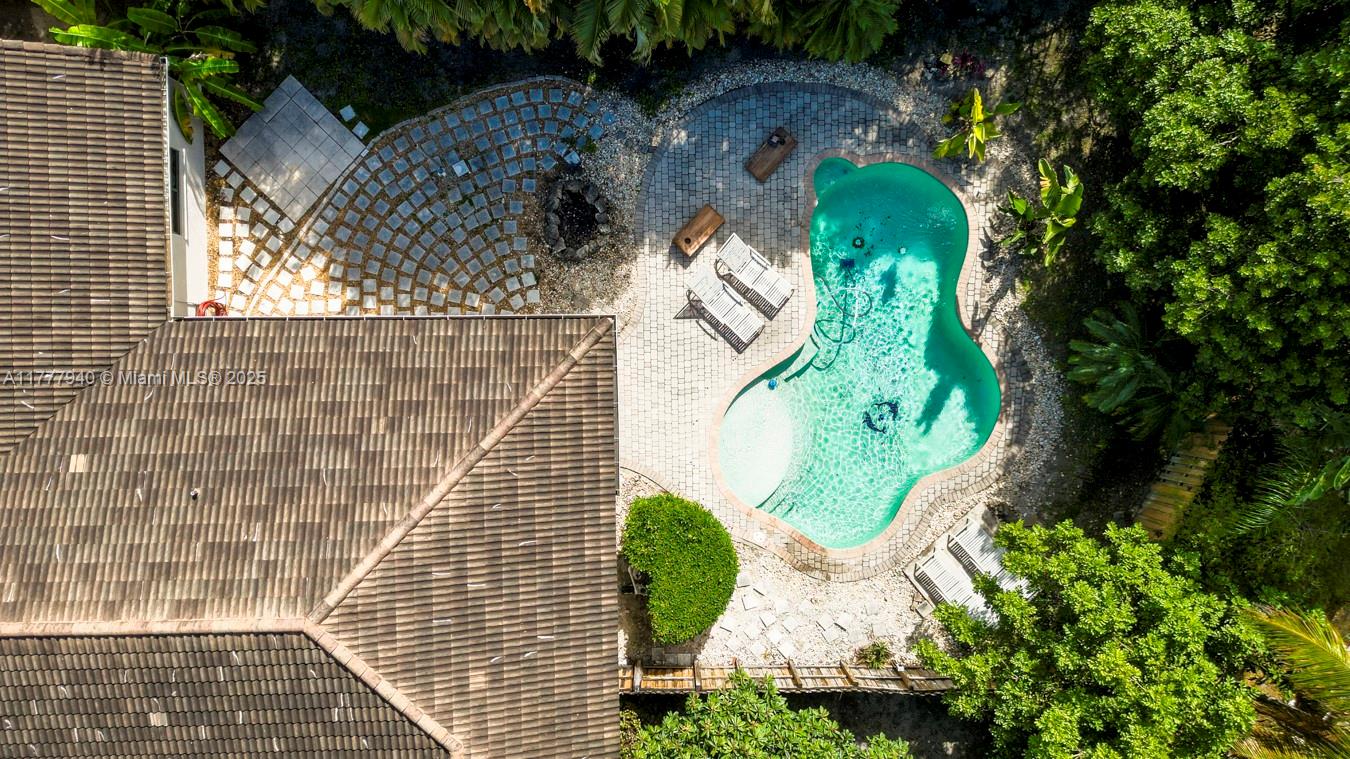 Inviting 4/2 home on a cul-de-sac in sought-after Crossbow. Double lot with fenced backyard lined with mature palm and fruit trees for extra privacy. Geometrically laid pavers with lush greenery offer a serene oasis for relaxation and outside activities. The pool has the option to convert to salt water and install a future fountain. Freshly painted exterior walls. Timeless custom-made Italian kitchen with stainless-steel appliances, vaulted ceilings, impact windows and doors. Separate dining and living rooms with ample space for entertaining. Generous walk-in closet in master bedroom. Double sinks and roman tub in the bathroom. Low HOA fees and easy access to I-75, shopping, restaurants, parks, equestrian facilities and A-rated schools make this location ideal for a vibrant lifestyle.