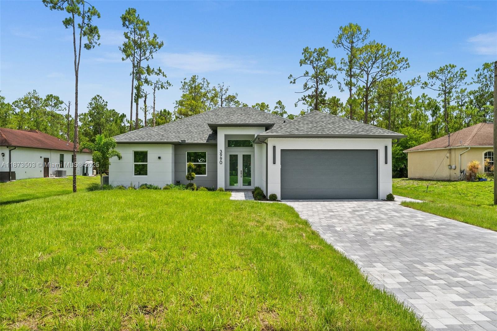 BRAND-NEW HOME on a 1.14-acre 100% upland lot, with 1,774 sq. ft. A/C living area and 2,950 sq. ft. under roof. Constructed residence 2025.It features 4 bedrooms and 3 full bathrooms,the kitchen with quartz countertops,waterfall island,soft-close cabinets,and high-end stainless steel appliances. There are custom built-in closets in every bedroom. The two-car garage boasts an epoxy finish.Includes a reverse osmosis water purification system.The kitchen,bathrooms,exterior paver floors,and spacious backyard highlight.You can building a pool or guest house; there is no HOA and no restrictions for pets.If you seek quality of life surrounded by nature,close to the beach,in a peaceful.Just minutes from the City of Ave Maria and Naples, restaurants, top schools, and beaches.HOME WARRANTY INCLUDED!
