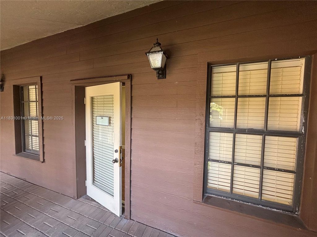 Photo of 7320 Griffin Rd #214, Davie, FL 33314 (MLS # A11831001)