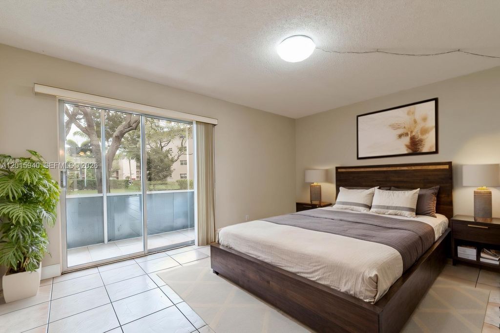 Photo of 13355 SW 9th Ct #104H, Pembroke Pines, FL 33027 (MLS # A12015940)
