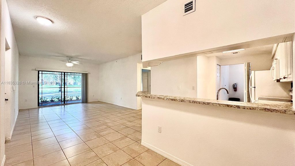 Photo of 3021 Alcazar Pl #101, Palm Beach Gardens, FL 33410 (MLS # A11635326)