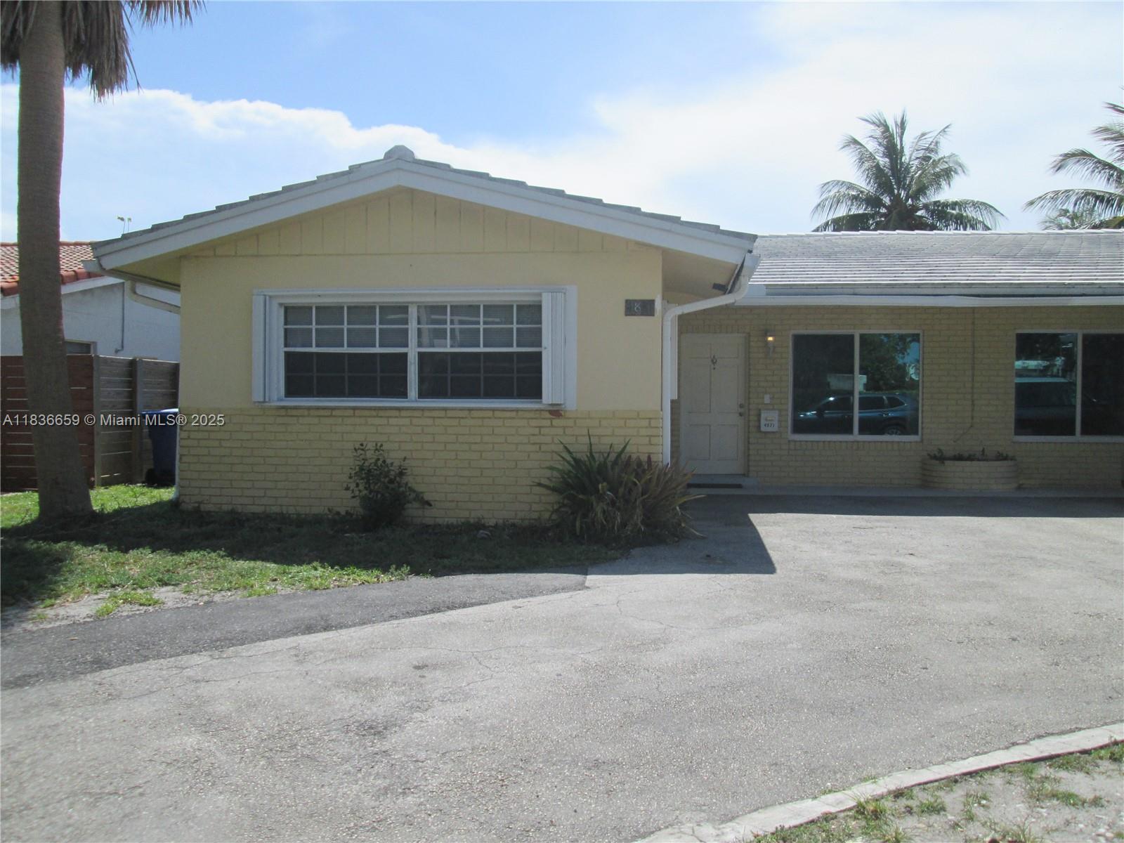 Spacious and upgraded including hurricane impact windows throughout, kitchen and baths updated in the past 5 years, tiled throughout and freshly painted. Large open kitchen with family room or dining area, utility room with washer and dryer and extra storage space. Bedrooms are generous sized with walk in closets and fans in every room. Back yard for relaxing or entertaining. Short walk to Lauderdale by the Sea beach and pier and restaurants, bakeries, etc. Only 2 blocks from Cardinal Gibbons and children's park with new eliptical equipment. Easy to show, come check it out, perfect location.
