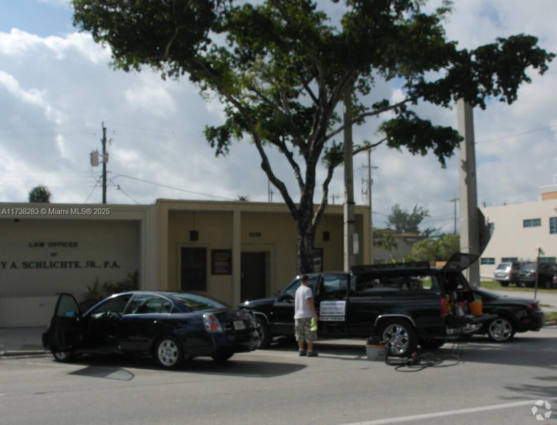 Law Office Building with Separately Assessed Parking Lot. Great Exposure on Hollywood Boulevard. Can be used as professional office by Buyer or possible Redevelopment Site. Currently set up with 2 offices and a conference room.
