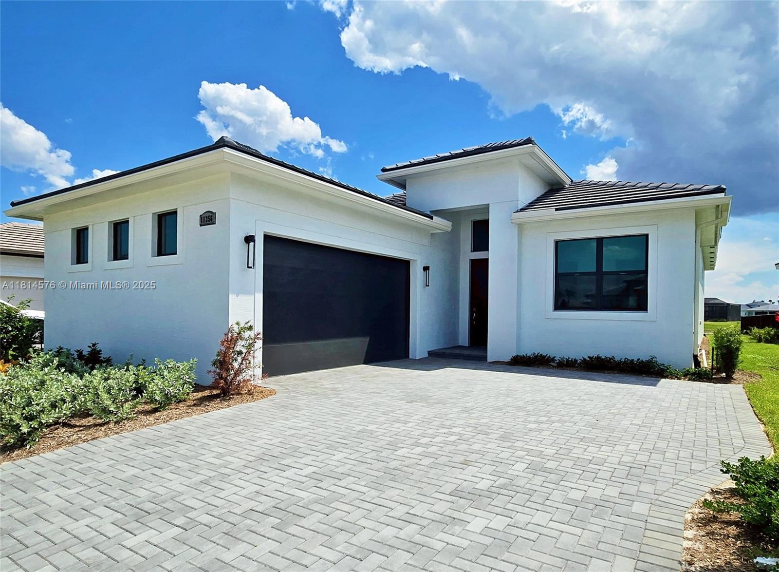 Look no further...you've just found your little piece of paradise to spend time in sunny Florida! This spectacular residence newly built in 2024.This home is filled with light with an elegant and spacious open plan. with a huge kitchen island. Prepare gourmet meals overlooking the stunning lake. All state-of-the-art GE appliances. Close to shopping and I-95. All windows, sliders and doors are hurricane impact glass. Internet, cable and all the luxurious resort-style amenities are included: state-of-the-art fitness center, aerobics studio, sauna and heated indoor pool and ongoing social events. Incredible 27 pickle-ball courts and 5 tennis and basketball courts! This is your opportunity. Ready for your magical stay! You won't want to leave!