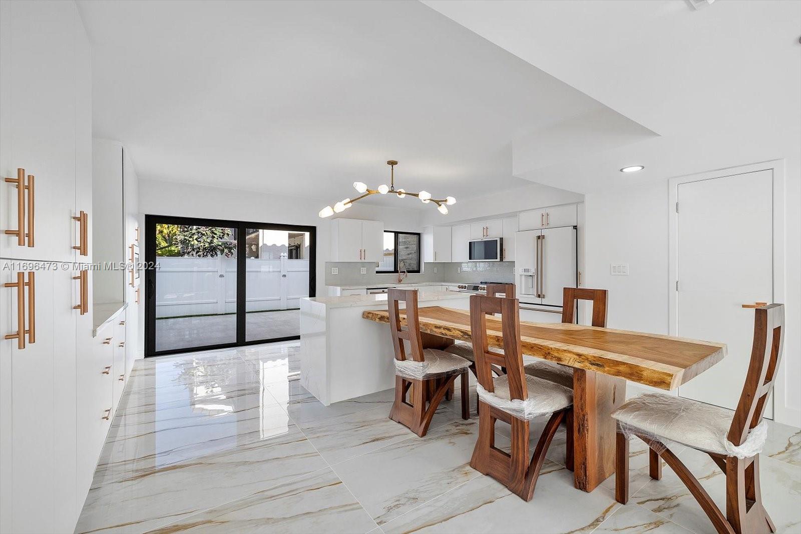 Exquisitely modern and totally renovated two story townhouse on great location. It has 1590 sf, 3 bedrooms 2 & 1/2 bath in desirable Lakeview development on Eastern Shores. Featuring all impact windows & doors, new modern Italian kitchen with island, exclusive Cafe collection of stainless steel appliances, new extra large porcelain floors, new modern bathrooms, in bathroom speaker system, new fence patio great for entertaining, over-sized balcony off master, new lamps plus recessed lighting throughout, all new a/c, high capacity washer & dryer. Steps to the pool area w/ 2 assigned parking spaces and plenty of guest parking. New recently installed roof. Close to the beach , Aventura mall ( Sunny Isles), close distance to restaurants, Oleta Park, Shopping, Houses of Worship, theater & more.