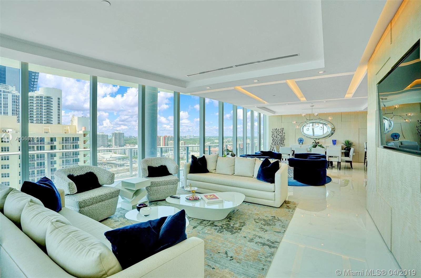 If you are truly looking for a home in the sky,you can stop looking with this fabulous condominium designed by an up and coming architect/designer.This is NOT a look and don't touch unit.Here, you are meant to come and enjoy every aspect of this spacious, beautiful home.Every piece of furniture was picked for relaxation and enjoyment purposes. This apartment offers all the modern conveniences such as 4 bedrooms all en suite with fantastic views,and a separate bedroom that can be utilized as an office/housekeeper/in-law's quarters.Condo is located next to a state of the art Playground and is surrounded by A rated public and private schools. Minutes from Aventura Mall, Bal Harbour shops,South beach and Brickell . And did I mention that it's TURNKEY?