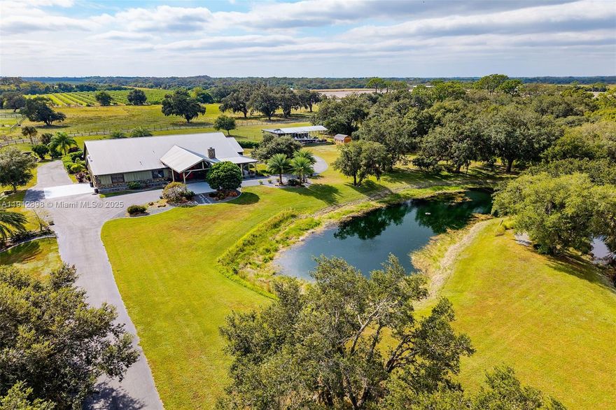 Don't miss this one-of-a kind home on 4.62 ACRES.Beautifully designed 4,123 sq ft. 3-bed/2.5-bath offers the perfect blend of luxury, comfort & functionality for the whole family.Private circular driveway, as you pass the perfectly manicured lawn and pond, as you drive to porte-cochere. Walk into living-room with high wood beam ceilings, Australian Cypress floor, hand selected stone water-fall and stone fireplace. Heated pool and jacuzzi, patio area has electric shades,sono’s sound system,outdoor covered kitchen and bar, and poolside firepit.  The property offers a 2 car garage, 25x48 covered RV port with 50 amp hookup, separate detached 20x20 office building with half bath, 12x12 workshop/ shed, reverse osmosis water system,11 zone sprinkler system, mosquito misting system,40KW Generac.