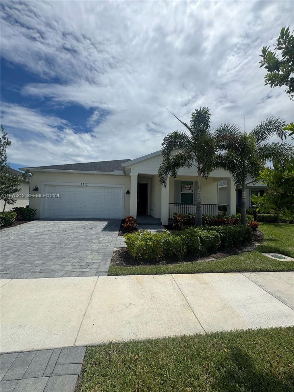 Photo of 6712 NW Cloverdale Ave, Port St Lucie, FL 34987 (MLS # A11975212)
