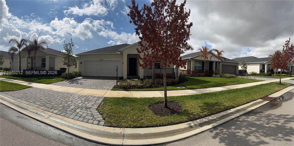 Photo of 6712 NW Cloverdale Ave, Port St Lucie, FL 34987 (MLS # A11975212)