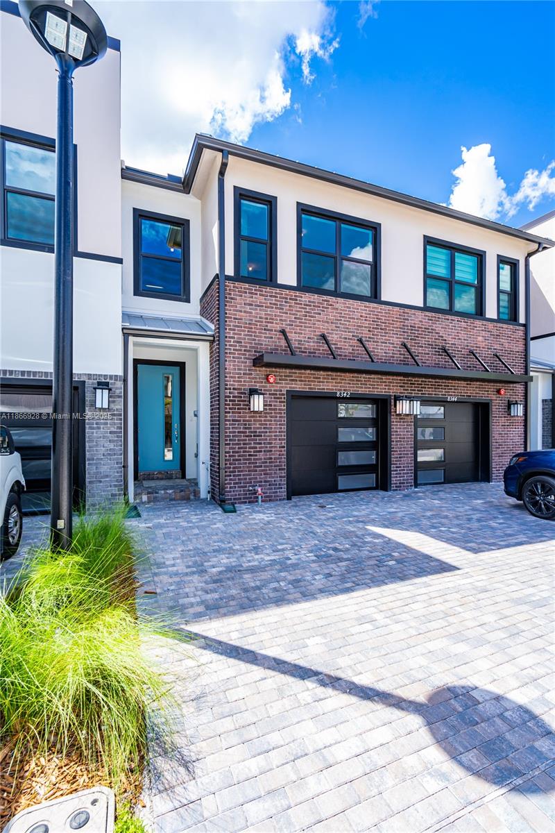 Enjoy modern living in this stylish townhome at Plantation Midtown Square! Situated in a secure, gated community, this home stands out with its distinctive design. It features 3 bedrooms, 2.5 bathrooms, a 1-car garage, and a 2-car driveway. The open-concept kitchen is a highlight, complete with an island, granite countertops, stainless steel appliances, and tile flooring on the first level, while the second floor is carpeted. Additional features include high-impact windows and doors, an open patio, and convenient proximity to dining options, hospitals, and I-595 for easy commuting. The community offers a pool, BBQ grills, an outdoor lounge area, and a dog park. Rent includes AT&T internet and lawn care. Schedule a tour today and make this dream home yours!