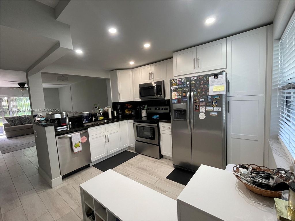 Photo of 1290 S Military Trl #411, Deerfield Beach, FL 33442 (MLS # A11913430)