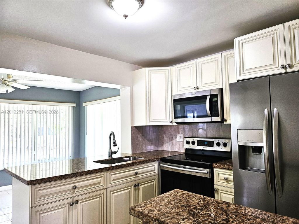 Photo of 1040 NW 73rd Ter, Margate, FL 33063 (MLS # A12012281)
