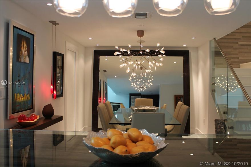 READY TO MOVE! THIS STUNNING 3 BEDROOM/ 3 BATH TOWNHOME HAS BEEN DESIGNER REMODELED AND IS FULLY FURNISHED BY "ARTEFACTO". FEATURING NEW GLASS STAIRCASE, BAR AREA, CUSTOM MADE TV UNITS, DOUBLE HEIGHT CEILINGS IN LIVING ROOM AREA. ENJOY THE STUNNING MIAMI SUNRISES, BAY VIEWS AND AMAZING DIRECT OCEAN VIEW FROM A PRIVATE, WIDE BALCONY ON FIRST FLOOR OR DIRECTLY FROM THE MASTER BEDROOM'S 2ND FLOOR BALCONY. TOP OF THE LINE APPLIANCES. THE BEST DESIGNED TOWNHOME UNIT IN THE BUILDING. A MUST SEE !!! 
UNIT IS RENTED FULLY FURNISHED (ARTWORK NOT INCLUDED)