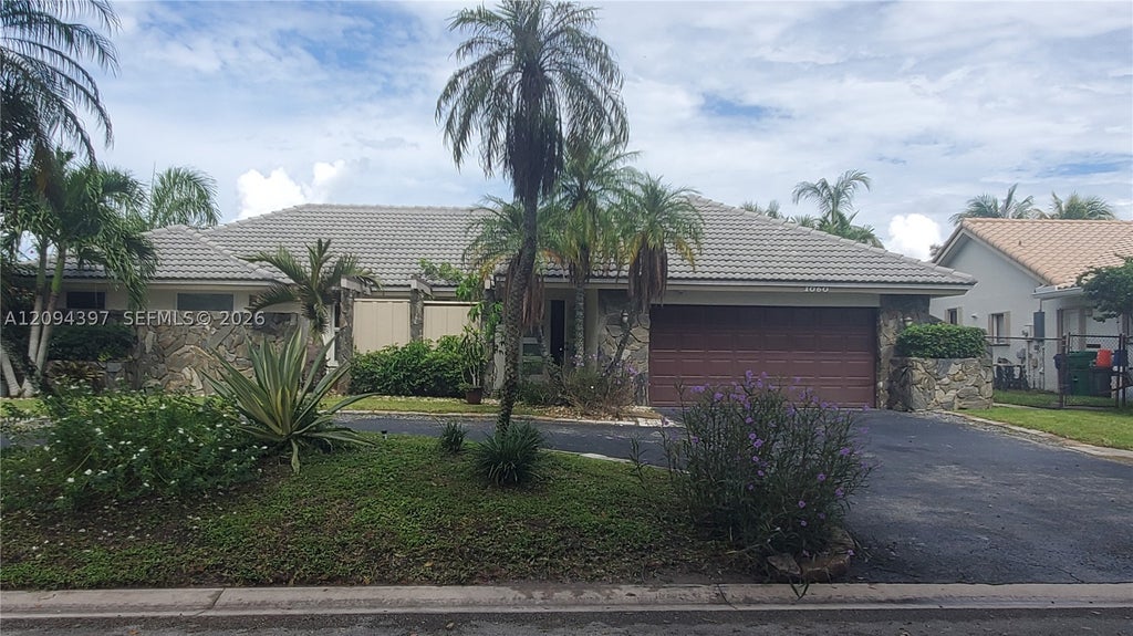 Photo of 1060 NW 110th Ln #1060, Coral Springs, FL 33071 (MLS # A12094397)