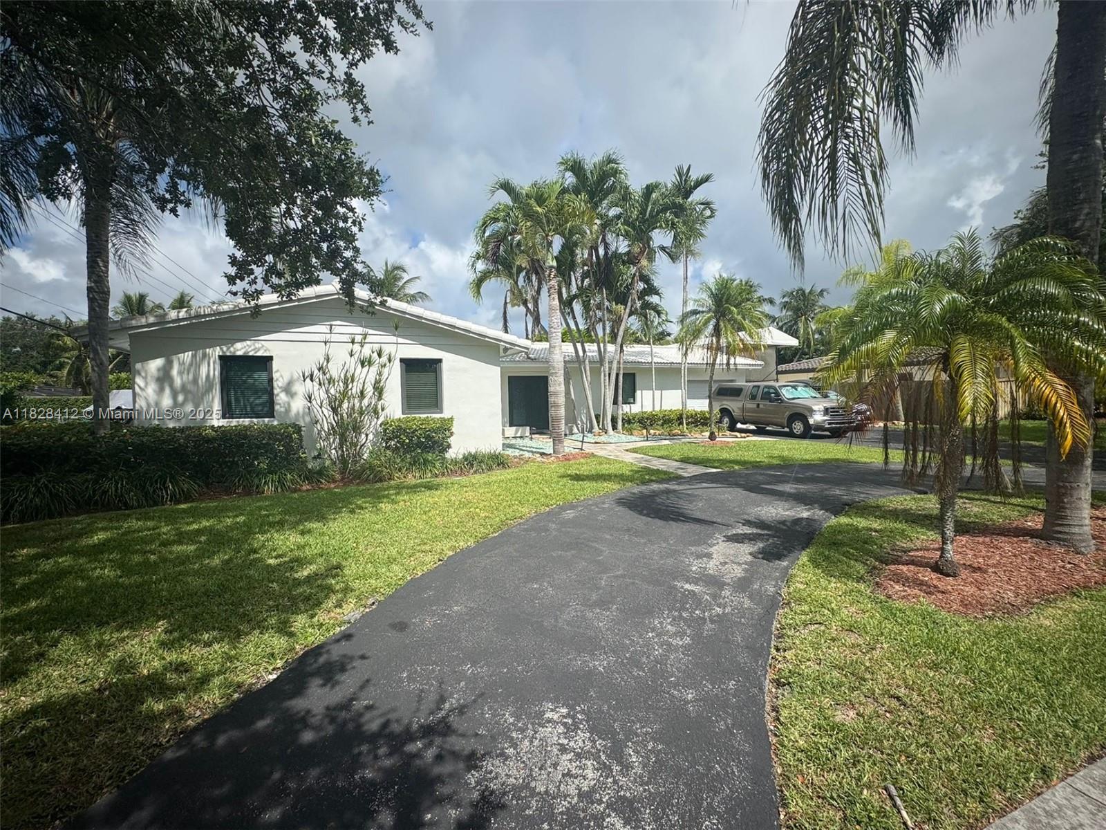 Welcome to your tropical retreat in highly desirable PALMETTO BAY This beautifully maintained home offers a combination of functionality and Florida charm. Boaters will love the gated, covered boat yard on asphalt with pilaster lock—fits up to a 38’ vessel on trailer. Relax in the heated saltwater pool with brand-new finish, surrounded by lush landscaping and low-voltage path lighting. a new electrical panel and weather head, a 2-zone irrigation system on a private well, and is wired for both a monitored alarm system and CCTV including Glenn & Valencia Pride mangoes, and a Russel avocado tree, IMPACT WINDOWS AND DOORS a private oasis with space for your boat, smart updates, and a tropical garden lifestyle all in a prime location close to great schools, parks, bay. PICTURES COME SOON