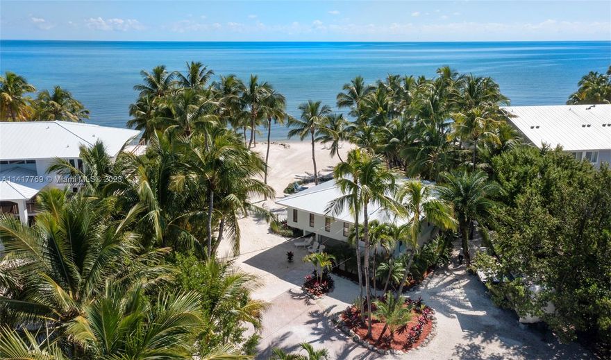 Ocean Oasis, a private oceanfront estate with sandy walk-in beach, pool, outdoor bar and a hammock retreat where you may enjoy rocking your cares away under the coconut palms. The perfect setting for unforgettable celebrations, romantic get aways or family gatherings, the Islamorada Beach House residence includes two living levels with three bedrooms, 2 baths, living, dining, kitchen and laundry upstairs and offers 2 bedrooms, 2 baths and kitchenette with laundry on the lower level. Convenient lockout owners closets found on each level provide plenty of storage for a turn-key experience. Huge area for parking. This estate offers best of both worlds as a private residence or a turn-key successful wedding venue/vacation property with a fully booked calendar for a substantial income.