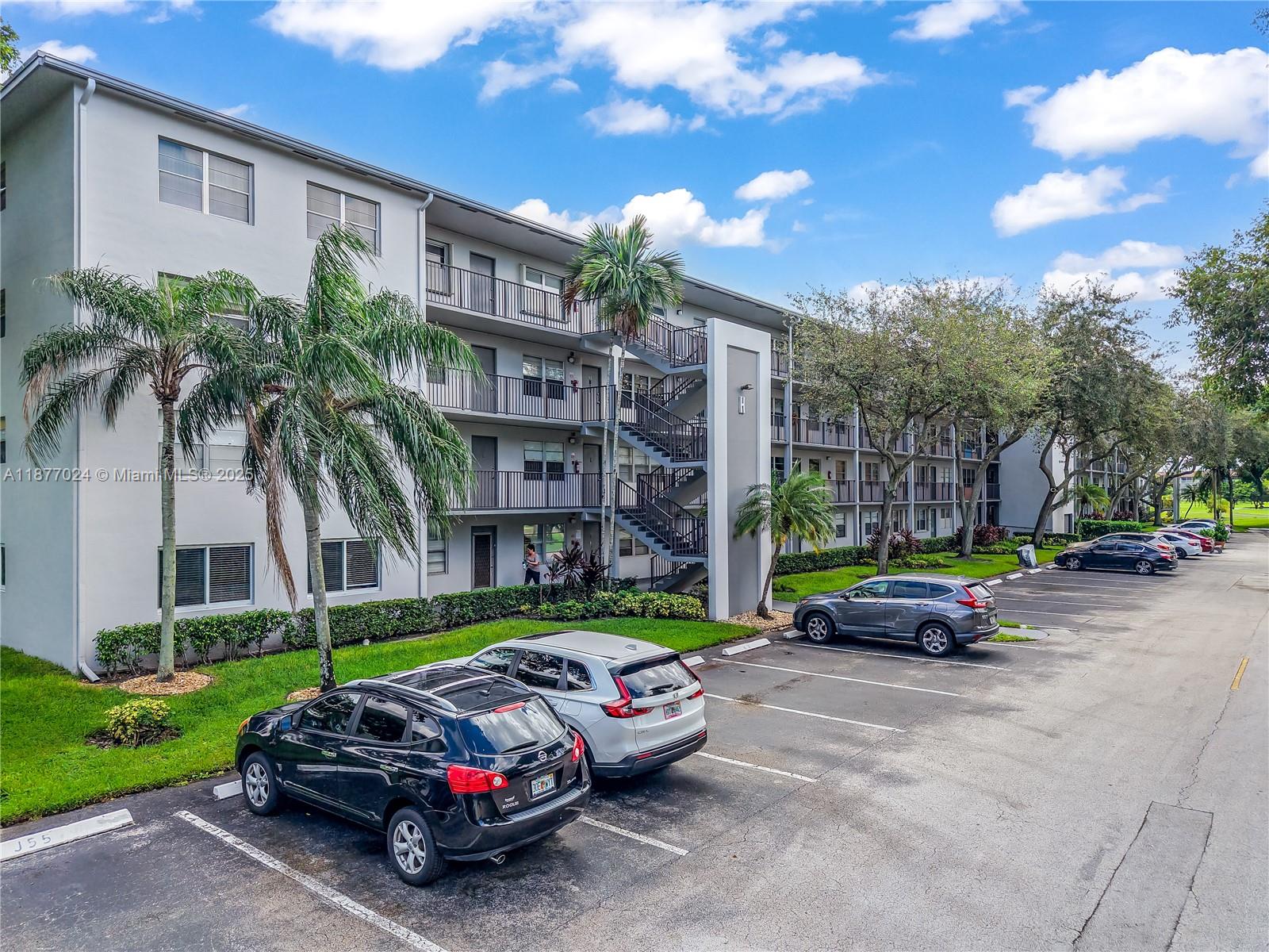 Beautifully upgraded 2BR/2BA corner unit in Century Village, a 55+ community. Features include ceramic tile floors with the look of marble, A beautifully appointed unit with an updated kitchen, wood cabinetry, sleek countertops, tile backsplash, and newer appliances. Spacious bedrooms with walk-in closets, updated bathrooms, and a large screened balcony off the second bedroom that has a serene garden view and storm shutters. The unit comes with a 6'x4' storage unit, laundry facility on the same floor, elevator in the building for ease, 1 parking space, and plenty of guest parking. Enjoy resort-style amenities including multiple pools, fitness centers, clubhouse, golf course, tennis, pickleball, entertainment, and endless social activities—all in a vibrant, gated community.
