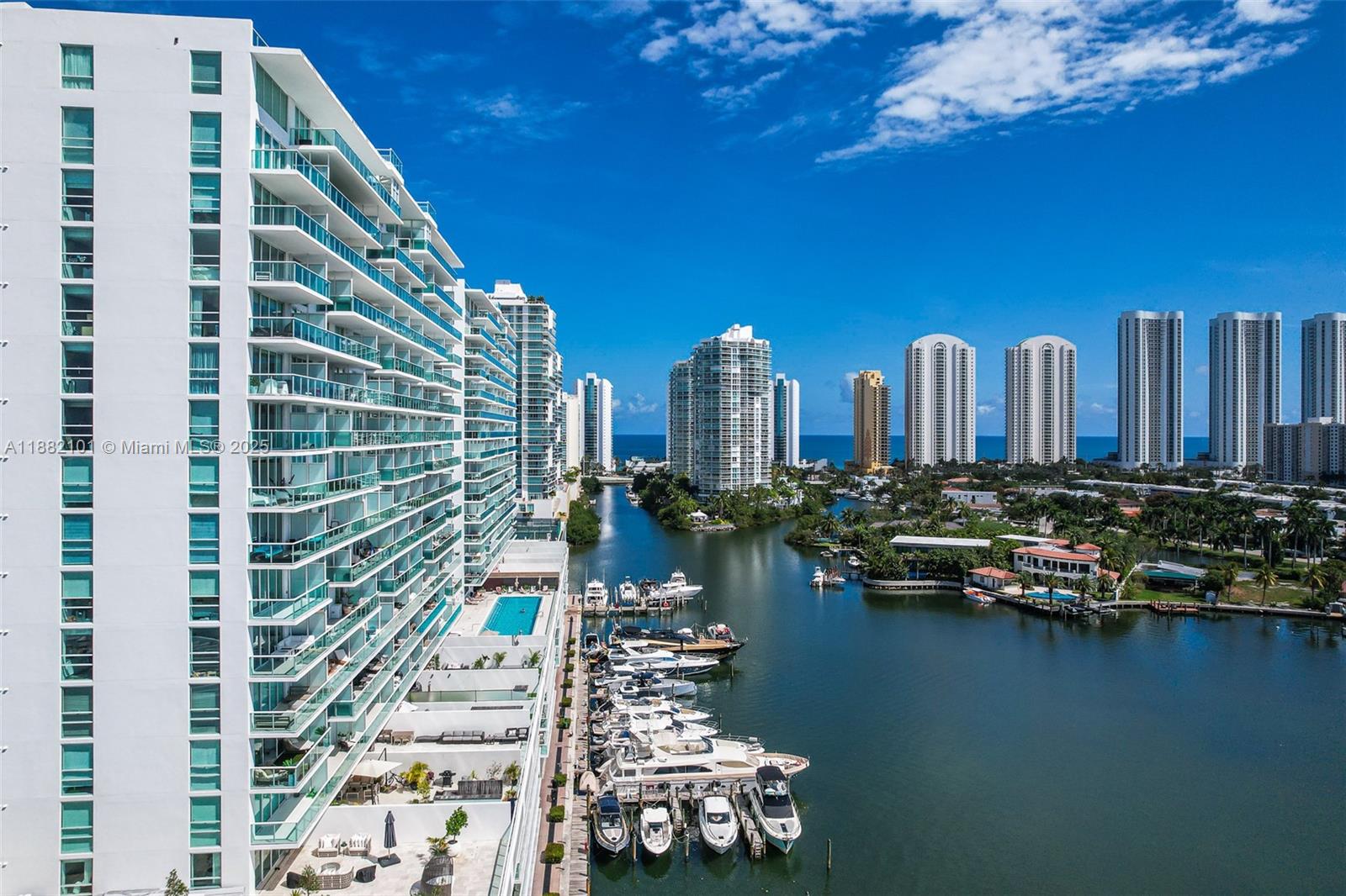 Luxury Waterfront Living! Experience the pinnacle of elegance in this stunning 3-bedroom, 3-bathroom duplex condo, impeccably designed and furnished by renowned designer Lu Marinho. Originally a 2-bedroom + DEN, the DEN has been converted into a private bedroom. The spacious master suite is situated on the upper level, featuring a luxurious en-suite bath and a walk-in closet. The lower level boasts an open-concept, a gourmet kitchen, and two additional bedrooms with full baths. Located in an exclusive waterfront community, this residence offers resort-style amenities, including: Spa & Fitness Center, private marina & boat storage, serene zen gardens, an expansive pool deck for relaxation and a Tennis court.