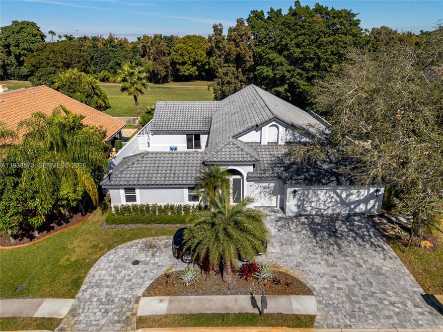 Beautiful courtyard pool home nestled in the desirable gated community of The Laurels at Grand Palms. This 4-bedroom plus den, 3.5-bath residence has been tastefully updated with impact glass, new flooring, and new pavers, along with a new back deck showcasing serene golf course views. The beautifully renovated kitchen opens seamlessly to the living areas and flows effortlessly to the private outdoor courtyard, an entertainer’s dream. The inviting pool area offers a spacious covered patio and leads to a detached suite with a full bath, ideal for guests, a home office, or multigenerational living. Roof replaced in 2011. A rare opportunity combining privacy, style, and resort-style living.