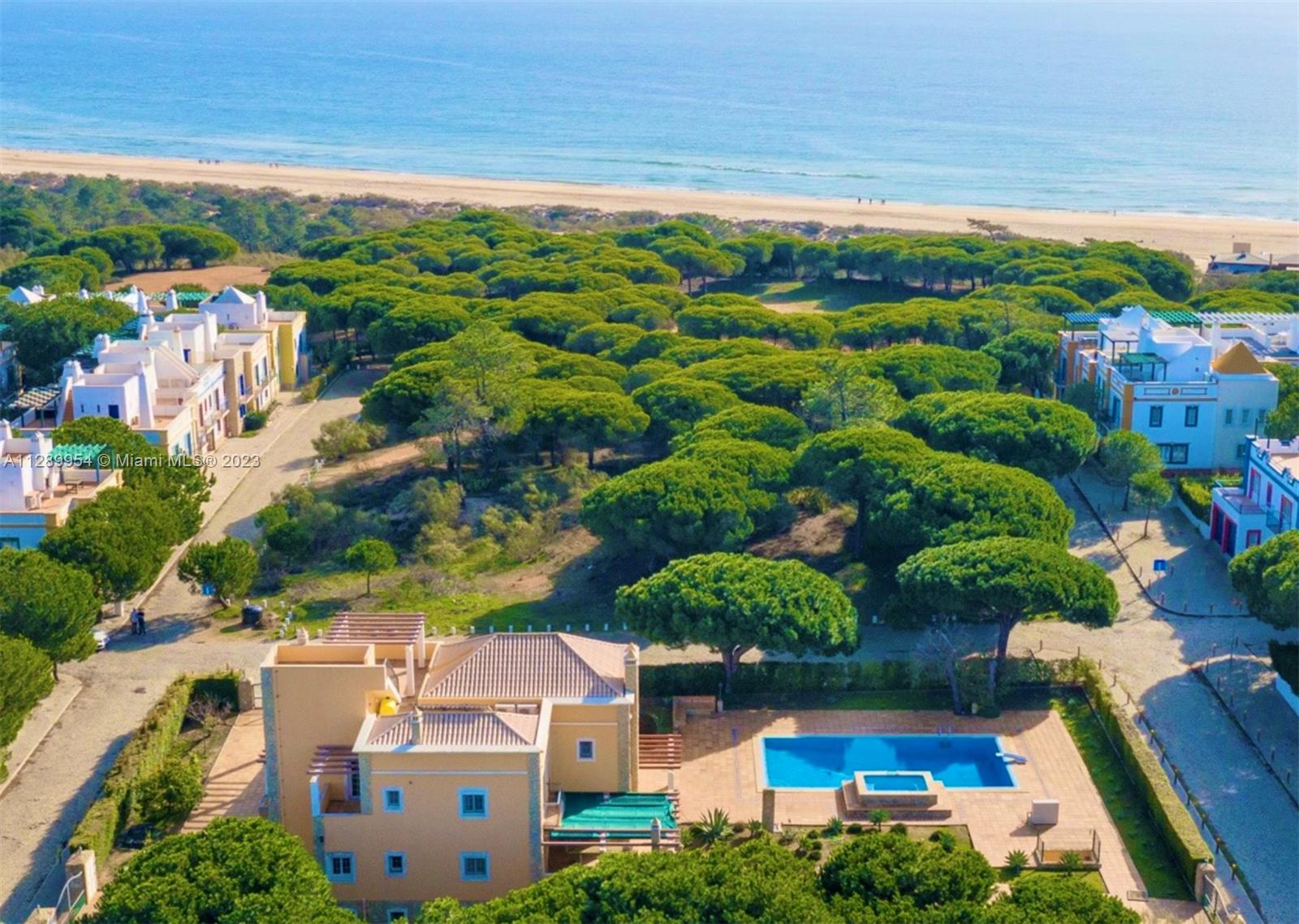 Located on the beach on the southern coast of Portugal near Spain alongside other villas and golf courses, this large villa is ideally situated to experience the best of the booming country of Portugal with all is Southern European flare. At a 45 minute drive from Faro international airport and with major cities located within an hour's drive, this beach front property is the perfect estate to experience Europe. With four en-suite bedrooms, a fifth ground level bedroom, with balconies and terraces in every room, large dining and living room areas, exterior barbecue areas and pool area, it's an entertainer and family paradise. Constructed in 2003 with an all concrete construction and with nothing but the best materials, the property is made to last for many generations to come.