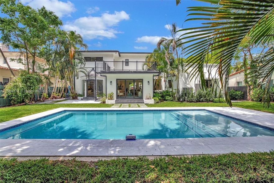 Fully remodeled, this contemporary marvel seamlessly blends Miami Beach elegance with modern finishes and systems. This 2 story open concept floor plan features include dual first and second floor primary bedrooms, a large terrace overlooking the backyard and pool area, new impact windows, custom millwork closets and built-ins throughout, wide plank white oak and large format porcelain slab flooring, contemporary LED Architectural lighting, 2 car garage epoxy floor coating, separate laundry room, staff quarters and a pristine saltwater swimming pool w/Tahoe marble deck areas set in new tropical landscaping. Just Minutes away from the beach, Design District, Brickell & Downtown. Located Near Miami’s Best Restaurants, Shopping & Entertainment. Vacant and ready to move in!