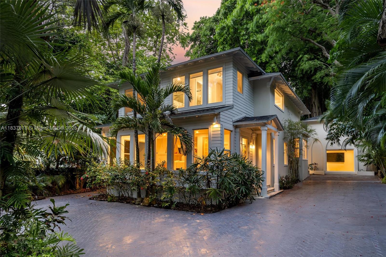 Discover a beautifully restored historic gem in the heart of South Coconut Grove. This 3,605 sq ft residence, fully renovated in 2021, offers 4 bedrooms and 5.5 bathrooms, including a detached guest house. The main home features a gourmet kitchen with island and peninsula, elegant living and dining areas, and direct access to a tropical oasis with pool and jacuzzi. The spacious primary suite offers serene garden views. The guest house includes a large living space, bedroom, bathroom, and kitchenette. A rare blend of sophistication, privacy, and timeless charm in one of Miami’s most desirable locations.