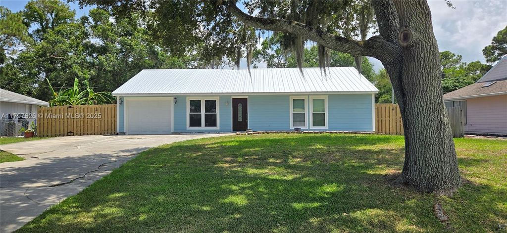 Photo of 7503 Paso Robles Blvd, Fort Pierce, FL 34951 (MLS # A11797626)