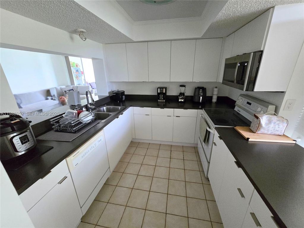 Photo of 1811 Sabal Palm Dr #408, Davie, FL 33324 (MLS # A11988052)