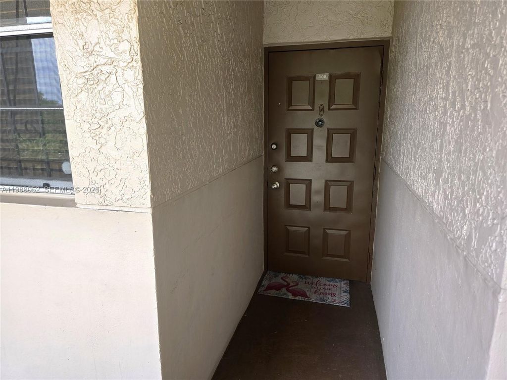 Photo of 1811 Sabal Palm Dr #408, Davie, FL 33324 (MLS # A11988052)