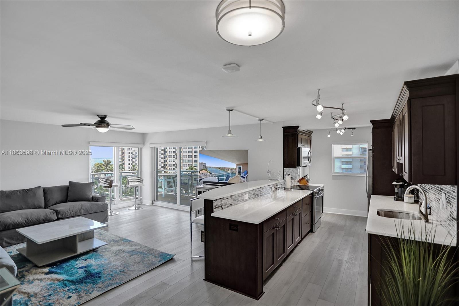 Stunning fully furnished corner unit in Hillsboro Beach is available for Annual Rental. This beautifully maintained residence offers an open floor plan,two spacious bedrooms, master suite w/walk-in closet and additional storage. Impact windows and doors, granite countertops, stainless steel appliances, and electric window shades across double sliding doors that open to a large wrap-around balcony with breathtaking views of both the Intracoastal Waterway and the ocean. Covered parking space under the bldg., semi-private floors with only 7 units , 64 units in total. Enjoy a heated resort-style pool, fitness room, BBQ area, and community boat dock (with some restrictions).* Free washers and dryers are conveniently located on each floor.* 1st,last, and security required.Private Beach access