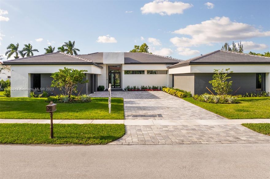 Spectacular one-story new construction (2023) home with a total of 7209 SQFT in Weston, Florida. The home features 6 beds, 6.5 baths, an expansive driveway, top-of-the-line appliances, high ceilings, Italkraft top-of-the-line kitchen cabinets, Italian and Spanish ceramic tiles, and a large pool with a covered terrace. Enjoy the tranquility of this fantastic location with panoramic views of the lake in this spacious, nicely appointed new home perfect for a family. Weston is known for its A+ school district, parks, and green areas. Three-car garage!