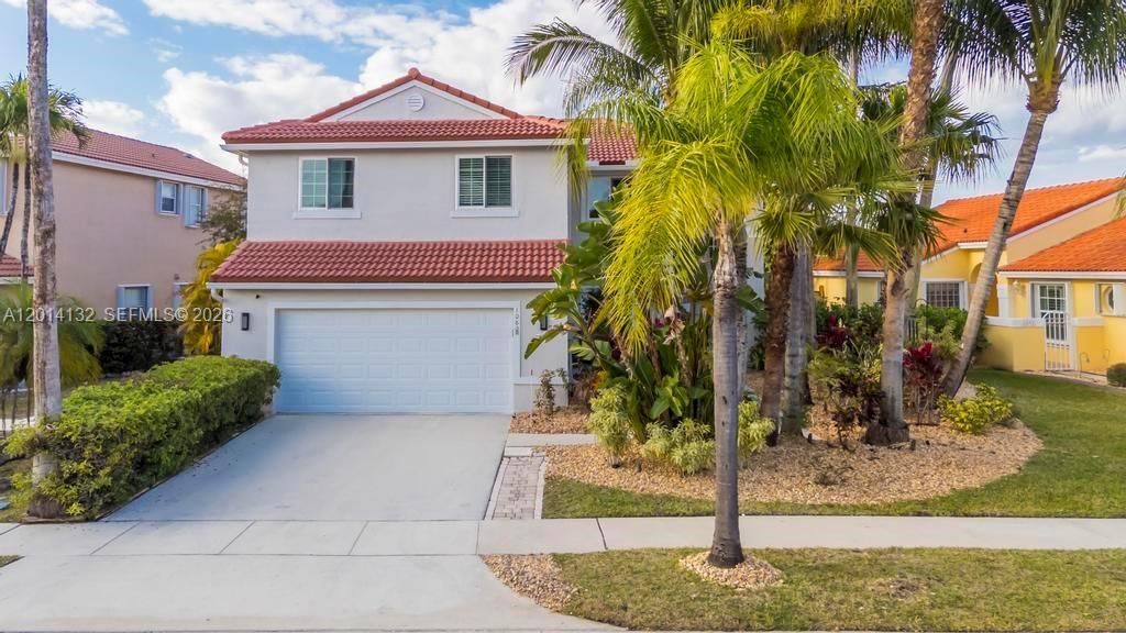 Photo of 1080 NW 192nd Ave, Pembroke Pines, FL 33029 (MLS # A12014132)