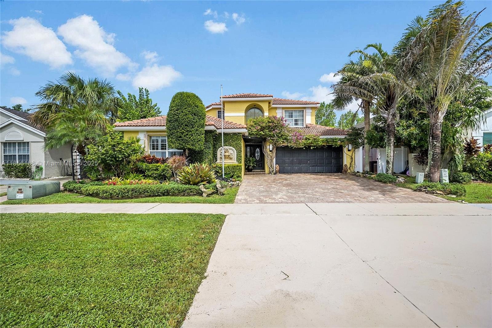 Beautifully upgraded 4-bedroom (2 suites), 3.5-bath home with vaulted ceilings, crown moldings, plantation shutters, and hardwood floors throughout. Spa-style bathrooms with rain showers and jets; master bath with Italian marble floors and walls. Chef’s kitchen with newer appliances, waterfall quartz island, and hot tower. Outdoor summer kitchen with BBQ grill and pizza oven under wood-paneled patio ceiling. Oversized pool with spa blower, marble pool deck, and tropical fruit trees. Features hurricane shutters, tankless water heater, brick driveway, oversized garage with custom closet, upgraded half bath, mud room, and hi-hat lighting throughout. HOA offers tennis courts, pickleball courts, and kids playground.