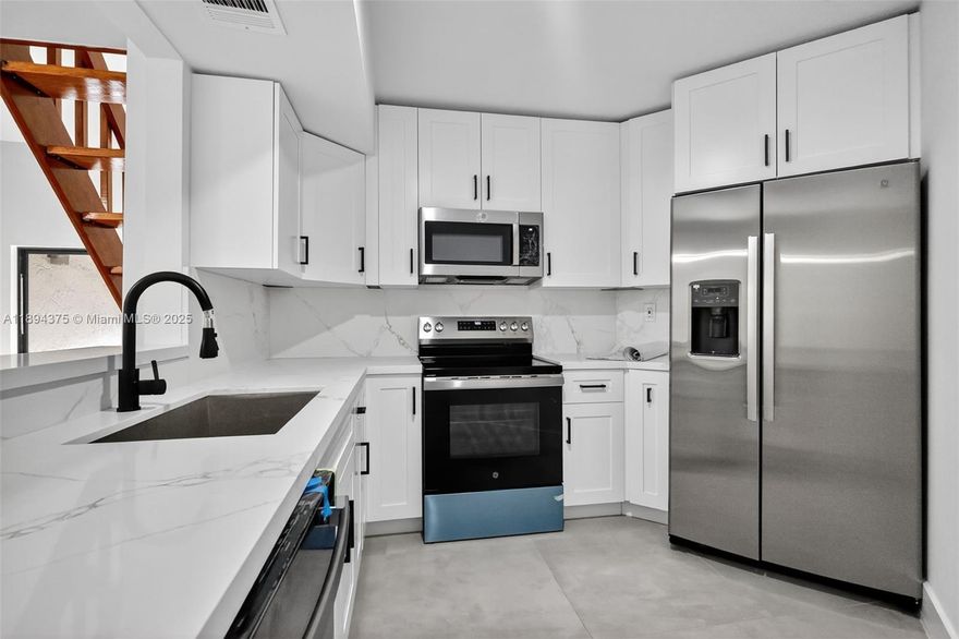 READY TO MOVE IN! COMPLETELY UPDATED CONDO! 3rd bedroom is a loft! IN-UNIT WASHER AND DRYER! Features Brand New quartz counter tops and stainless steel appliances. Primary bedroom with en-suite bathroom with a combination tub and shower. Guest bathroom with walk-in shower. Centrally located near the Dolphin Expy, FIU, and major shopping centers. HOA offers a Pool and Tennis Court!