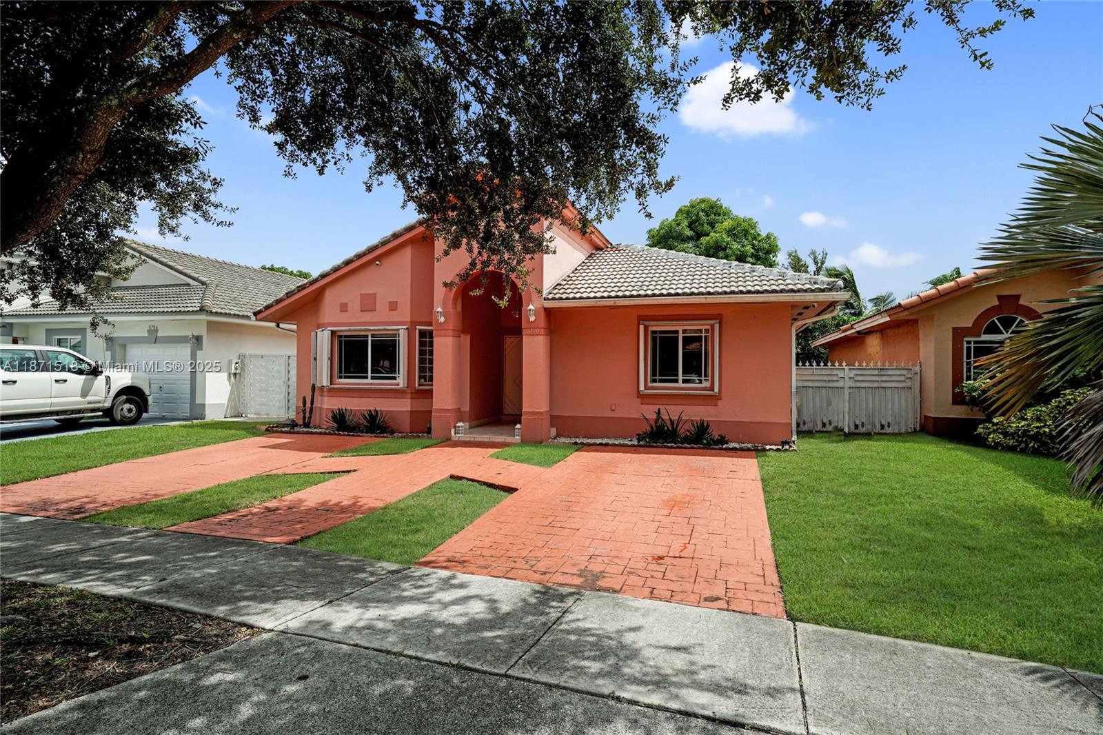 Miami Lakes 3-Bedroom Home – No HOA!
Discover this charming 3-bedroom, 2-bath home located in the heart of Miami Lakes with no HOA fees. Inside, you’ll find a new AC unit, newer appliances, and a blend of tile and laminate flooring throughout. The spacious primary suite features two walk-in closets and a relaxing roman tub, while the second bedroom also offers its own walk-in closet.
Step outside to a covered patio overlooking a fenced yard complete with a mature mango tree, perfect for outdoor living. The home also comes equipped with exterior security cameras for added peace of mind, a storage room and plenty of natural light. Conveniently located within walking distance to Barbara Goldman High School and just minutes from shopping, dining, and entertainment options in Miami Lakes.